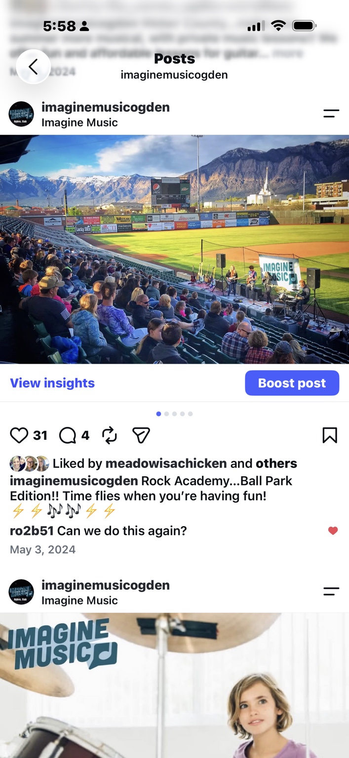 Imagine Music Rock Academy students performing beside the field for a large Ogden ballpark audience with the Wasatch Mountains behind them