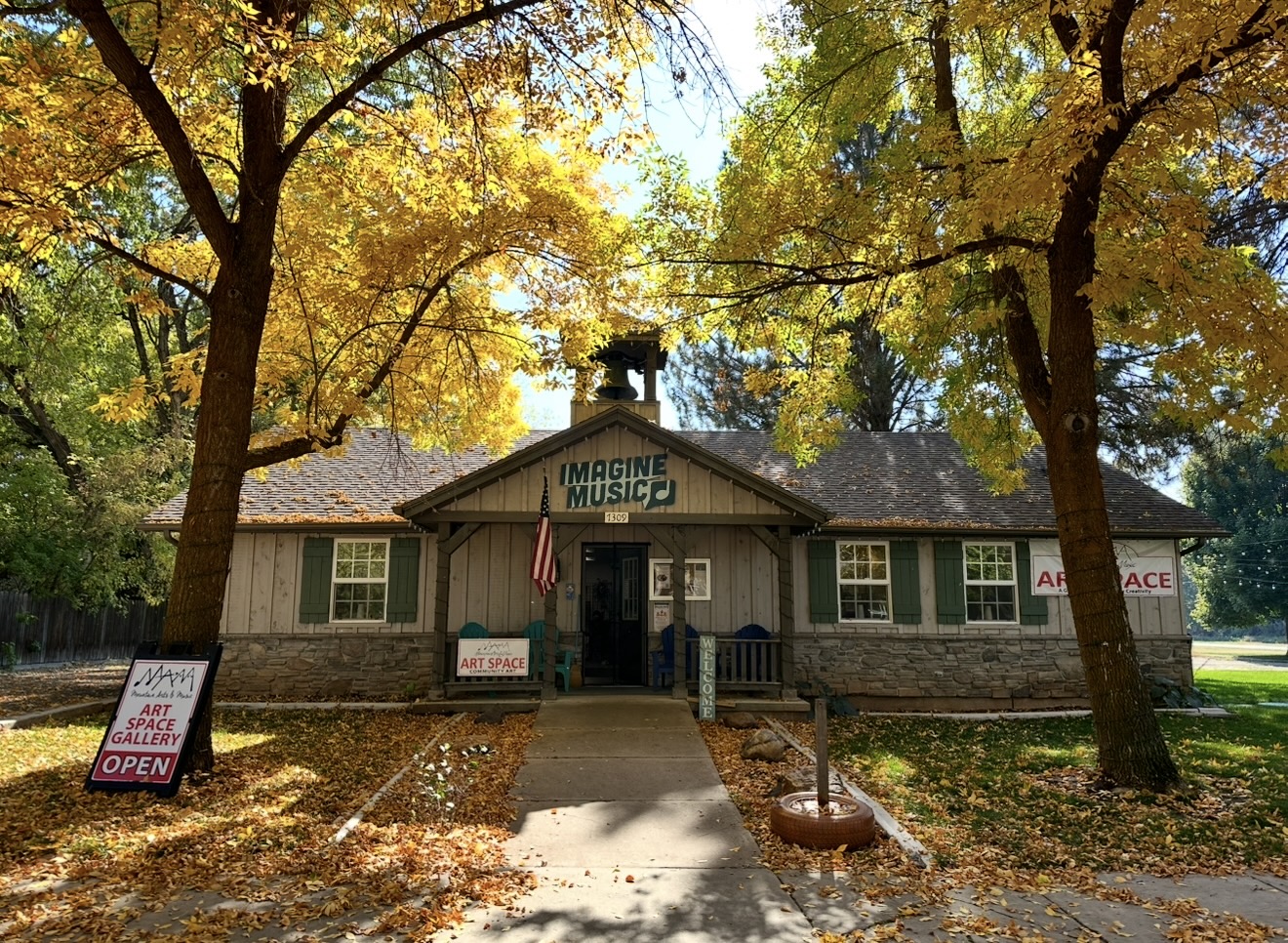 Imagine Music’s Huntsville location inside Historic Old Town Hall beneath autumn trees