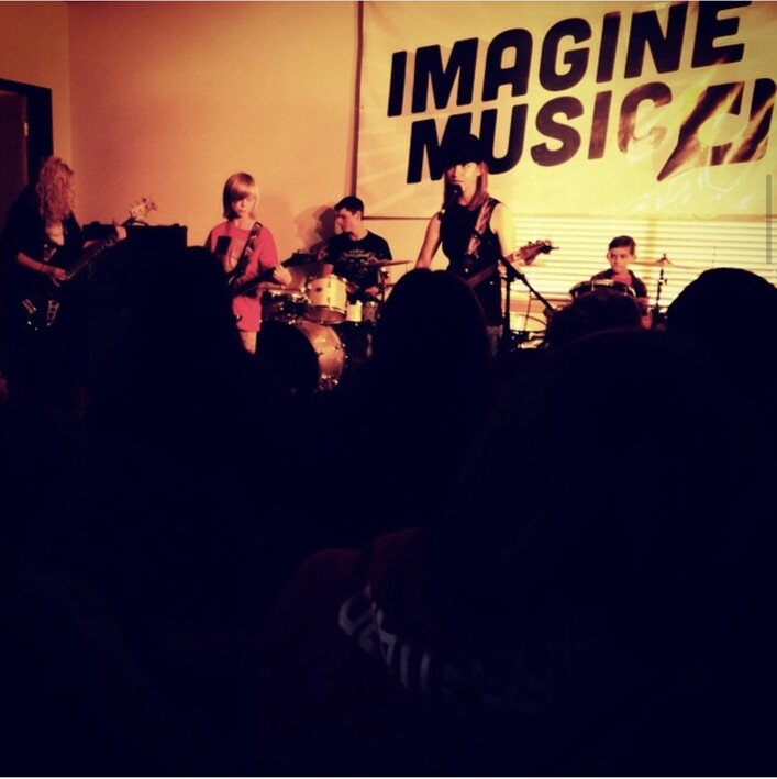Students performing at the first Imagine Music Rock Band Concert in May 2015