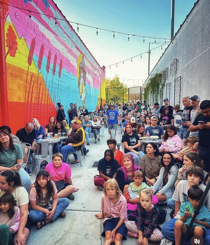 A large Ogden audience watching Imagine Music Rock Academy perform at Van Sessions in 2025